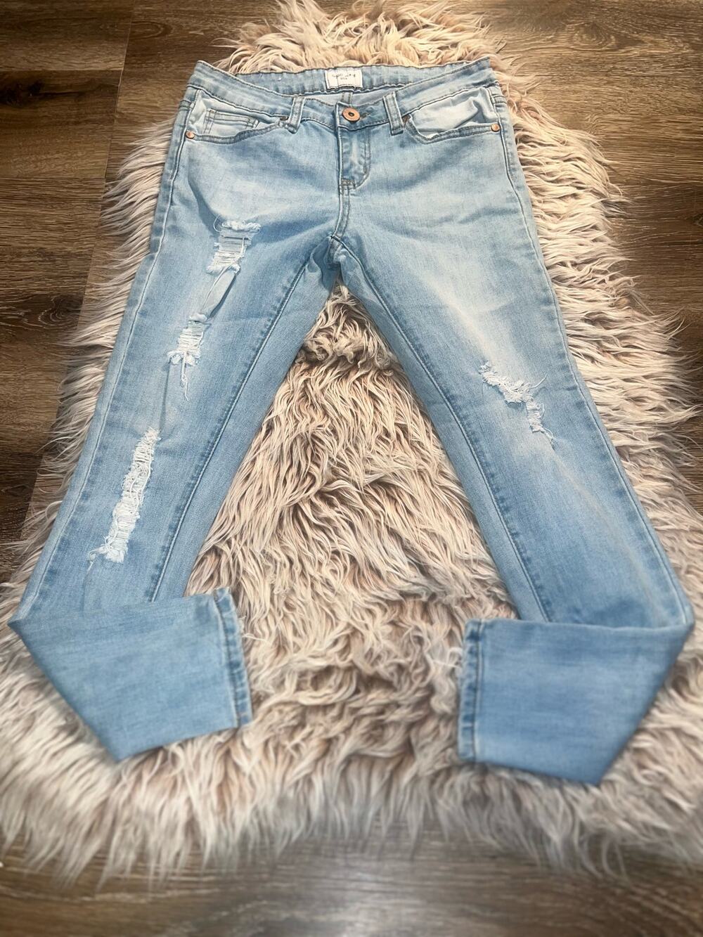 Gogo women’s distressed blue jeans